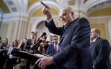 Senate Majority Leader Chuck Schumer, a New York Democrat, answers questions on the border security talks as he meets reporters following a Democratic caucus meeting, at the Capitol in Washington, January 31, 2024. (AP Photo/J. Scott Applewhite)