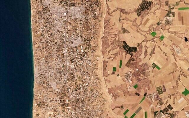 BEFORE: This satellite photo from Planet Labs PBC shows the Gaza Strip on Aug. 9, 2023. Satellite photos show new demolition along a 1-kilometer-deep path on the Gaza Strip's border with Israel, according an analysis by The Associated Press and expert reports. The destruction comes as Israel has said it wants to establish a buffer zone there. (Planet Labs PBC via AP)