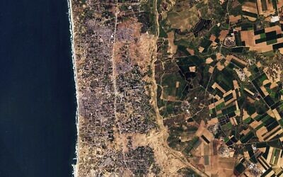 This satellite photo from Planet Labs PBC shows the Gaza Strip on January 30, 2024. Satellite photos showed new demolition along a 1-kilometer-deep path on the Gaza Strip's border with Israel, according to an analysis by The Associated Press and expert reports. (Planet Labs PBC via AP)