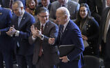 President Joe Biden, right, and House Speaker Mike Johnson, center, during the National Prayer Breakfast, Thursday, Feb. 1, 2024, at the Capitol in Washington. (AP/J. Scott Applewhite)