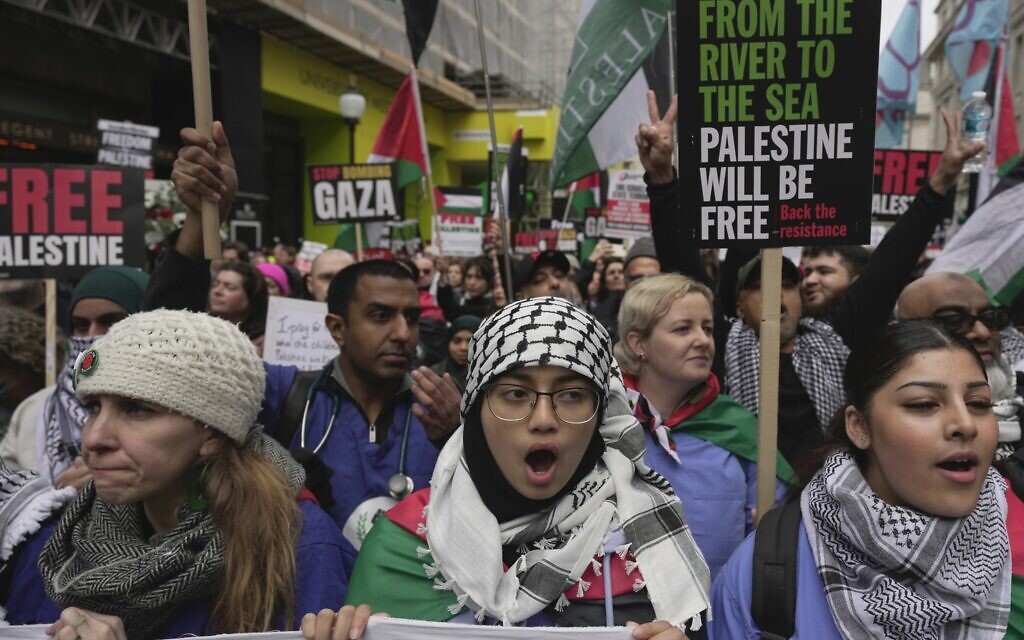 Protesters hold up banners, flags and placards during an anti-Israel demonstration in London, Feb. 3, 2024  (AP Photo/Kin Cheung)