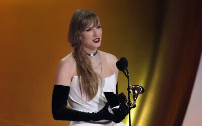 Taylor Swift accepts the award for album of the year for "Midnights" during the 66th annual Grammy Awards on February 4, 2024, in Los Angeles. (AP Photo/Chris Pizzello)