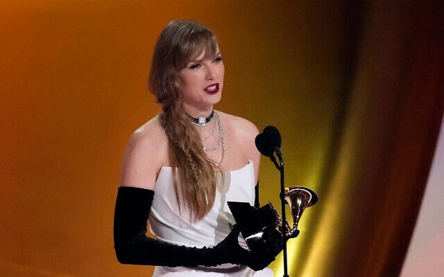 Taylor Swift accepts the award for album of the year for "Midnights" during the 66th annual Grammy Awards on February 4, 2024, in Los Angeles. (AP Photo/Chris Pizzello) Taylor Swift accepts the award for album of the year for "Midnights" during the 66th annual Grammy Awards on February 4, 2024, in Los Angeles. (AP Photo/Chris Pizzello)
