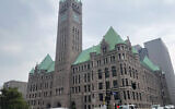 Cars drive past City Hall, June 28, 2023, in Minneapolis. (AP Photo/Trisha Ahmed, File)