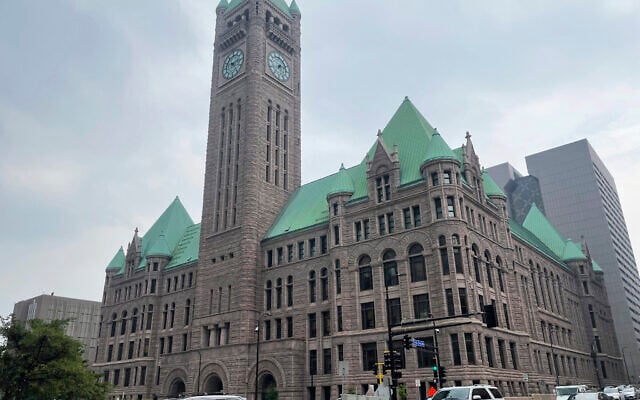 Cars drive past City Hall, June 28, 2023, in Minneapolis. (AP Photo/Trisha Ahmed, File)