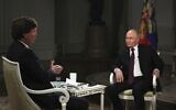 Photo released by Sputnik news agency showing Russian President Vladimir Putin, right, being interviewed by former Fox News host Tucker Carlson at the Kremlin in Moscow, February 6, 2024. (Gavriil Grigorov/Sputnik, Kremlin, Pool Photo via AP)