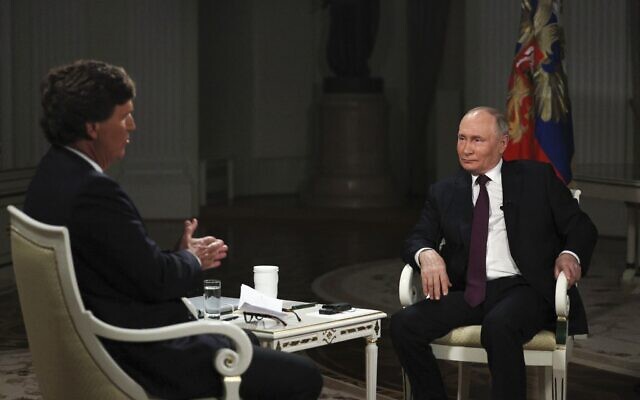 Photo released by Sputnik news agency showing Russian President Vladimir Putin, right, being interviewed by former Fox News host Tucker Carlson at the Kremlin in Moscow, February 6, 2024. (Gavriil Grigorov/Sputnik, Kremlin, Pool Photo via AP) Photo released by Sputnik news agency showing Russian President Vladimir Putin, right, being interviewed by former Fox News host Tucker Carlson at the Kremlin in Moscow, February 6, 2024. (Gavriil Grigorov/Sputnik, Kremlin, Pool Photo via AP)