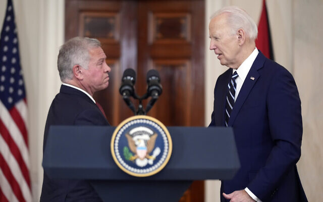 Jordan's King Abdullah II shakes hands with US President Joe Biden in the Cross Hall of the White House, February 12, 2024, in Washington. (AP Photo/Andrew Harnik)