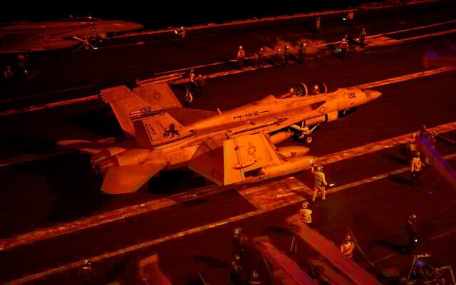 An F/A-18F Super hornet fighter jet seen before taking off from the USS aircraft carrier Dwight D. Eisenhower, in the south Red Sea, February 12, 2024. (Bernat Armangue/AP)