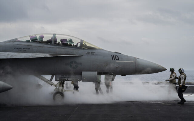 An F/A-18F Super Hornet fighter jet takes off from the  aircraft carrier USS Dwight D. Eisenhower, in the south Red Sea, February 13, 2024. (Bernat Armangue/AP)