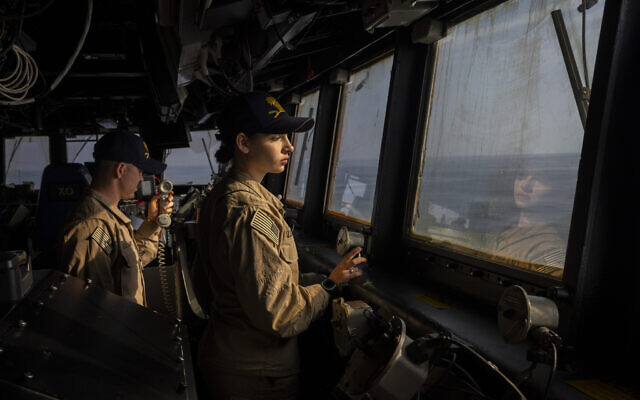 Crew members work on the bridge of the USS Gravely (DDG 107) destroyer in the south Red Sea, February 13, 2024. (Bernat Armangue/AP)
