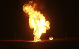Flames leap into the air after a natural gas pipeline explodes outside the city of Boroujen in the western Chaharmahal and Bakhtiari province, Iran, early February 14, 2024. (Reza Kamali Dehkordi/Fars News Agency via AP)