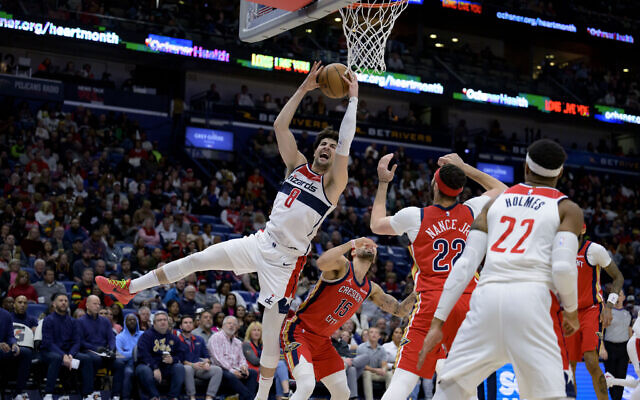 Washington Wizards forward Deni Avdija (8) grabs a rebound against New Orleans Pelicans guard Jose Alvarado (15) during the second half of an NBA basketball game against the Washington Wizards in New Orleans, Wednesday, Feb. 14, 2024. (AP Photo/Matthew Hinton) Washington Wizards forward Deni Avdija (8) grabs a rebound against New Orleans Pelicans guard Jose Alvarado (15) during the second half of an NBA basketball game against the Washington Wizards in New Orleans, Wednesday, Feb. 14, 2024. (AP Photo/Matthew Hinton)