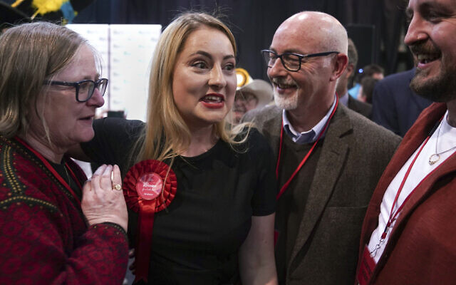 Labour Party candidate Gen Kitchen celebrates with her family after being declared winner in the Wellingborough byelection at the Kettering Leisure Village, Northamptonshire, Friday Feb. 16, 2024. (Joe Giddens/PA via AP) Labour Party candidate Gen Kitchen celebrates with her family after being declared winner in the Wellingborough byelection at the Kettering Leisure Village, Northamptonshire, Friday Feb. 16, 2024. (Joe Giddens/PA via AP)