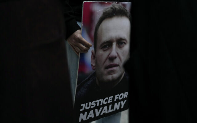 A person holds a picture of Russian opposition leader Alexei Navalny during a vigil in front of the Russian embassy in Lisbon, Friday, February 16, 2024. (AP Photo/Armando Franca) A person holds a picture of Russian opposition leader Alexei Navalny during a vigil in front of the Russian embassy in Lisbon, Friday, February 16, 2024. (AP Photo/Armando Franca)