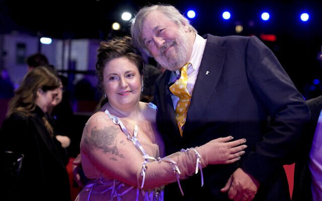 American writer, director and actress Lena Dunham, left, and British actor and comedian Stephen Fry pose for photographers at the premiere for the film 'Treasure' during the International Film Festival, Berlinale, in Berlin Saturday, February 17, 2024. (AP Photo/Ebrahim Noroozi) American writer, director and actress Lena Dunham, left, and British actor and comedian Stephen Fry pose for photographers at the premiere for the film 'Treasure' during the International Film Festival, Berlinale, in Berlin Saturday, February 17, 2024. (AP Photo/Ebrahim Noroozi)