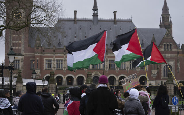 Demonstrators wave Palestinian flags as they protest outside the United Nations' highest court during hearings, in The Hague, Netherlands, February 19, 2024. (AP Photo/Peter Dejong) Demonstrators wave Palestinian flags as they protest outside the United Nations' highest court during hearings, in The Hague, Netherlands, February 19, 2024. (AP Photo/Peter Dejong)