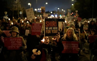 Women hold torches during a march demanding the immediate release of the Israeli hostages held in the Gaza Strip by the Hamas terror group, in Jerusalem, February 19, 2024. (AP Photo/Leo Correa)