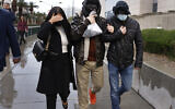 Former FBI informant Alexander Smirnov, center, leaves the courthouse on Tuesday, Feb. 20, 2024, in Las Vegas. (Bizuayehu Tesfaye/Las Vegas Review-Journal via AP)