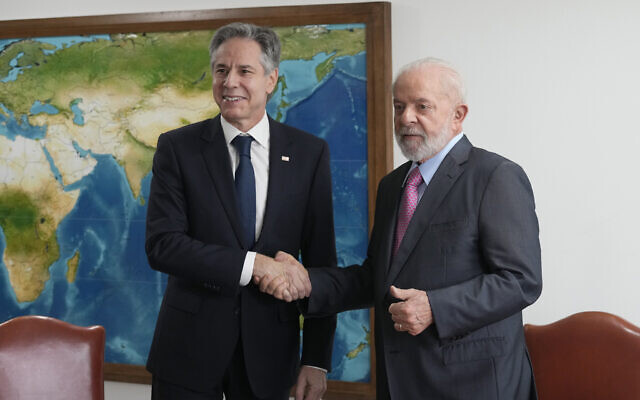 US Secretary of State Antony Blinken, left, shake hands with Brazil's President Luiz Inacio Lula da Silva, during a meeting at Planalto presidential palace, in Brasilia, Brazil on Feb. 21, 2024. (AP Photo/Eraldo Peres)