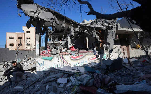 Palestinians inspect the rubble of the Al Daalese family building after an Israeli airstrike in Nusseirat refugee camp, central Gaza Strip, Thursday, Feb. 22, 2024. (AP Photo/Adel Hana) Palestinians inspect the rubble of the Al Daalese family building after an Israeli airstrike in Nusseirat refugee camp, central Gaza Strip, Thursday, Feb. 22, 2024. (AP Photo/Adel Hana)