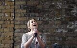British singer Charlotte Church performs during a Greenpeace protest against drilling for oil in the Arctic, outside the Shell Centre, London, August. 26, 2015. (Frank Augstein/AP)