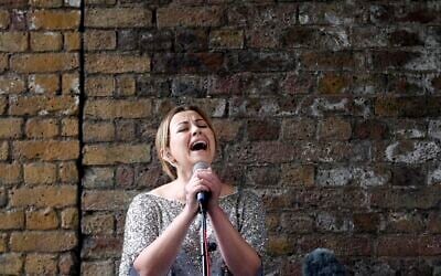 British singer Charlotte Church performs during a Greenpeace protest against drilling for oil in the Arctic, outside the Shell Centre, London, August. 26, 2015. (Frank Augstein/AP)