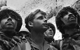 The iconic Rubinger photo of three paratroopers standing at the recaptured Western Wall in June 1967. From left: Tzion Karasenti, Yitzhak Yifat and Chaim Oshri (David Rubinger/GPO)