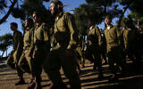 Ultra-Orthodox soldiers attend a swearing-in ceremony as they enter the IDF 'Nahal Haredi' unit, at Ammunition Hill in Jerusalem on May 26, 2012. (Miriam Alster/Flash90)