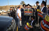 Ultra-Orthodox Jews during a protest in Rosh Pina, following the arrest of an Haredi man who failed to comply with the army draft, September 13, 2023. (David Cohen/Flash90)