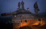 Israeli reservists are seen after a military drill in the Golan Heights, northern Israel, January 24, 2024. (Michael Giladi/Flash90)