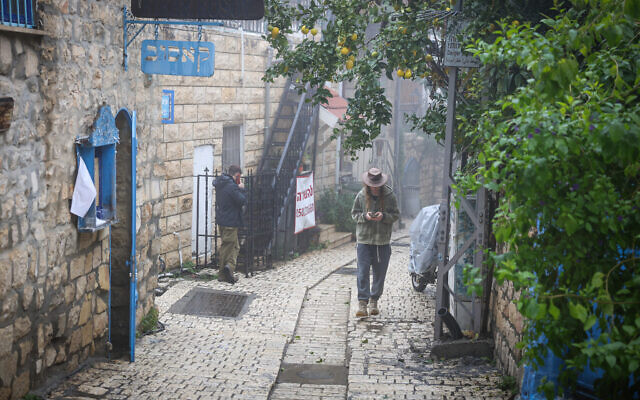 People walk in the Old city of Safed, northern Israel, February 4, 2024. (David Cohen/Flash90)