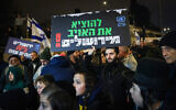 Israelis protest outside the UNRWA headquarters in East Jerusalem on February 5, 2024. (Chaim Goldberg/Flash90)
