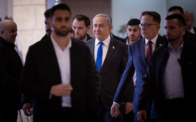 Prime Minister Benjamin Netanyahu, center, arrives for a Likud faction meeting at the Knesset on February 5, 2024. (Yonatan Sindel/Flash90) Prime Minister Benjamin Netanyahu, center, arrives for a Likud faction meeting at the Knesset on February 5, 2024. (Yonatan Sindel/Flash90)