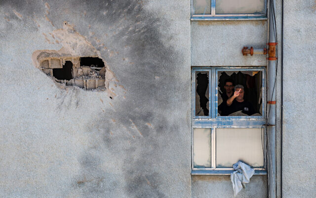 The damage after a rocket fired from Lebanon hit a building in the northern Israeli town of Kiryat Shmona, February 11, 2024. (David Cohen/Flash90)