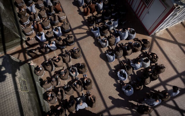 Alleged Hamas members who were caught during their October 7 terrorist massacre and during the IDF operation in the Gaza Strip, seen at a courtyard in a prison in southern Israel, February 14, 2024. (Chaim Goldberg/Flash90) Alleged Hamas members who were caught during their October 7 terrorist massacre and during the IDF operation in the Gaza Strip, seen at a courtyard in a prison in southern Israel, February 14, 2024. (Chaim Goldberg/Flash90)