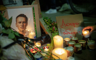 A protest following the death in jail of Russian opposition leader Alexei Navalny, outside the Russian Embassy in Tel Aviv, on February 16, 2024. (Erik Marmor/Flash90)