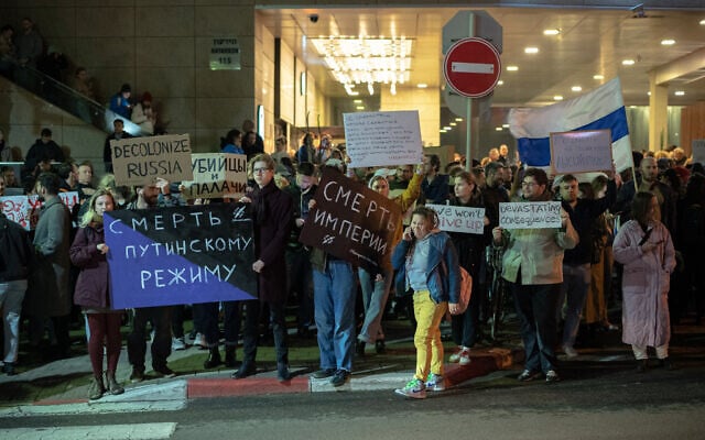 Demonstrators carry placards during a protest following the death of jailed Russian dissident Alexei Navalny, outside the Russian embassy in Tel Aviv on February 16, 2024. (Erik Marmor/Flash90) Demonstrators carry placards during a protest following the death of jailed Russian dissident Alexei Navalny, outside the Russian embassy in Tel Aviv on February 16, 2024. (Erik Marmor/Flash90)