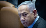 Prime Minister Benjamin Netanyahu attends a Knesset plenum session on February 19, 2024. (Yonatan Sindel/Flash90)