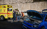 Police at the scene of a terror shooting attack on Route 1 near Ma'ale Adumim, in the West Bank, February 22, 2024. (Chaim Goldberg/Flash90)
