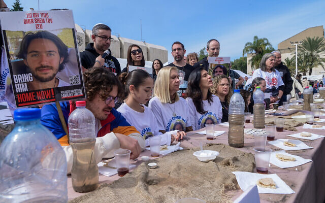 Families of Israelis held hostage by Hamas terrorists in Gaza gather around a table at 'Hostage Square' in Tel Aviv, February 24, 2024. (Avshalom Sassoni/Flash90) Families of Israelis held hostage by Hamas terrorists in Gaza gather around a table at 'Hostage Square' in Tel Aviv, February 24, 2024. (Avshalom Sassoni/Flash90)