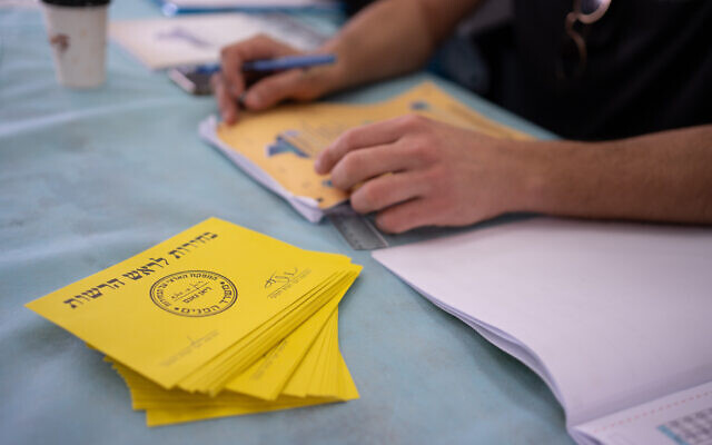 Israelis at a voting station during the Municipal Elections, in Moshav Haniel, on February 27, 2024. (Chen Leopold/Flash90)