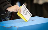 A woman votes in the municipal elections in Jerusalem, on February 27, 2024 (Noam Revkin Fenton/Flash90)