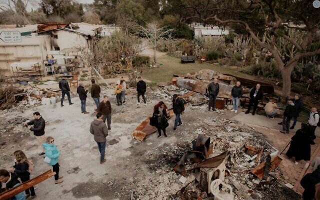 Members of a delegation of International Christian Embassy Jerusalem pastors tour what's left of Kibbutz Nir Oz in January 2024. (ICEJ)