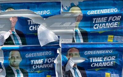 Posters for United Torah Judaism candidate Shmuel Greenberg defaced ahead of the 2024 municipal election in Beit Shemesh. (Sam Sokol)