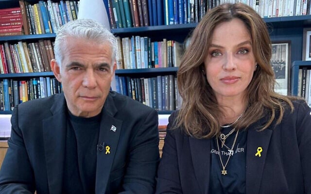 Yair Lapid (left) and Noa Tishby wearing the 3D-printed yellow ribbon pins created by industrial designer Shaul Cohen for the effort to release hostages held by Hamas. (Courtesy) Yair Lapid (left) and Noa Tishby wearing the 3D-printed yellow ribbon pins created by industrial designer Shaul Cohen for the effort to release hostages held by Hamas. (Courtesy)