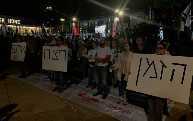 Silent demonstrators stand at Habima Square in Tel Aviv during an anti-government protest on February 10, 2024. (Charlie Summers/Times of Israel) Silent demonstrators stand at Habima Square in Tel Aviv during an anti-government protest on February 10, 2024. (Charlie Summers/Times of Israel)