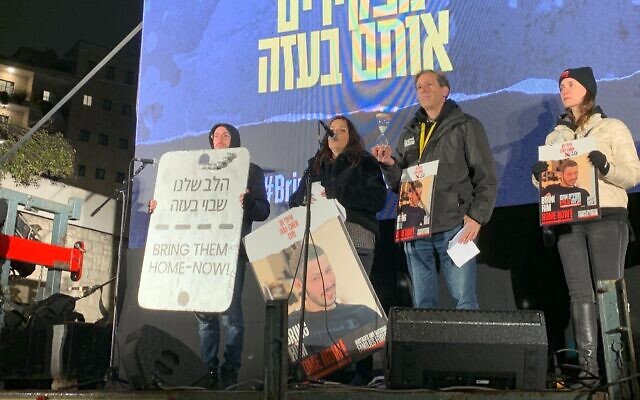 The family of captive Itay Chen addresses a demonstration outside Prime Minister Benjamin Netanyahu's residence in Jerusalem on February 17, 2024. (Charlie Summers/Times of Israel)