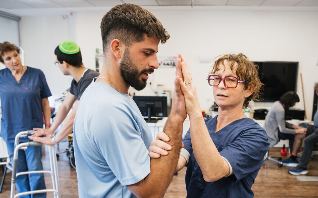 IDF veterans get physiotherapy treatments at Beit Halochem in Tel Aviv, 2024. (Mark Nomdar)
