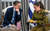 President Isaac Herzog meets with soldier Ori Megidish, who was taken hostage by Hamas on October 7 and freed in an Israeli military operation in Gaza in late October, at the President's Residence in Jerusalem, January 11, 2024. (Haim Zach/GPO)